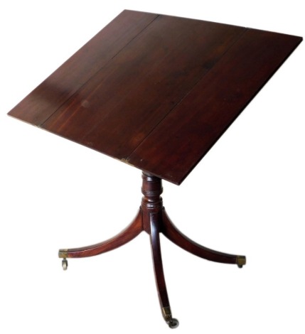 A George IV mahogany breakfast table, with a rectangular double hinged fold out top, on a turned column and four splayed legs with brass castors, 76cm high, 74cm wide enclosed.