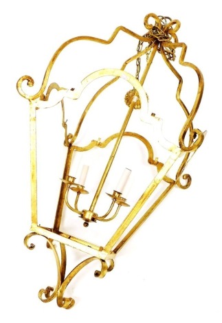 A gilt metal hall lantern, with a four branch light fitting, with suspension chain, lantern 120cm high.