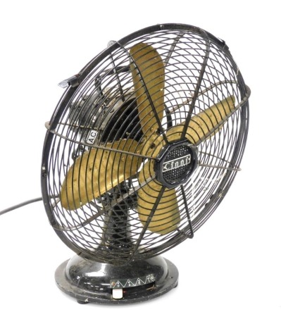 A mid century Cinni black metal desk fan, model number 31874, 39cm high.