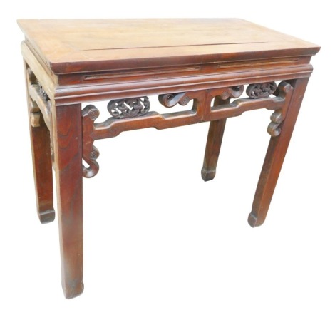 A late 19th/early 20thC Chinese elm altar table, the rectangular top above a pierced leaf carved frieze, on shaped legs, 84cm high, 92cm wide, 47cm deep.