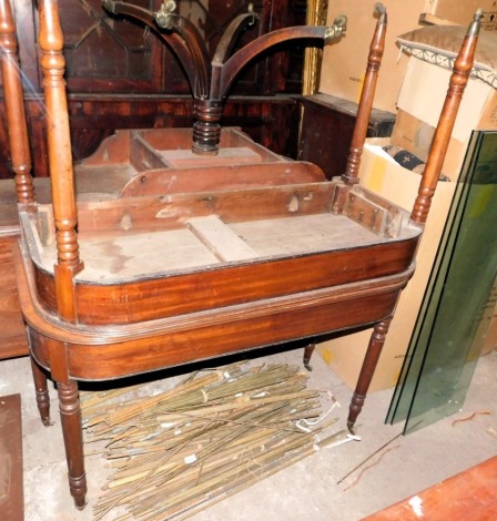 A Regency mahogany extending dining table, with D shaped ends with a moulded edge, on turned tapering legs, the associated central leaf with applied side mouldings, 200cm long.