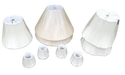 Two pairs of cream beige lamp shades, and three smaller shades, in original shrink wrap.