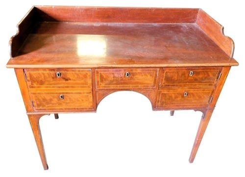 An early 19thC mahogany and chequer banded washstand, with a raised back above an arrangement of central drawer and two doors around a kneehole, on square tapering legs, 92cm high, 105cm wide, 54cm deep.