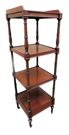 A Victorian walnut four tier whatnot, with a raised gallery, on turned supports with brass castors, 130cm high, 39cm wide.