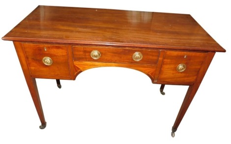 A 19thC mahogany desk or dressing table, the top with a moulded cornice above an arrangement of three drawers around a kneehole fan marquetry, on square tapering legs with brass castors, 76cm high, 108cm wide, 52cm deep.