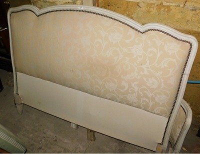 An early to mid 20thC French double bed, with a cream painted show frame, padded bed head and foot, 150cm wide.