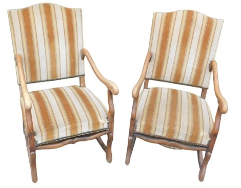 A set of 18 beech framed open armed chairs, with H stretchers and upholstered in stripped fabric.