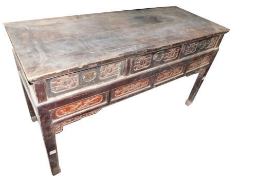 A late 19th/early 20thC Chinese elm altar table, with a rectangular top above an arrangement of carved drawers, on shaped legs, 91cm high, 157cm wide, 62cm deep.