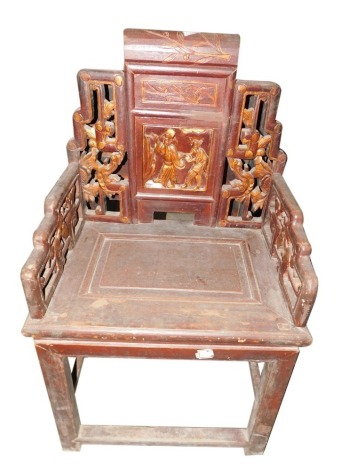 A Chinese elm throne or armchair, the shaped back elaborately carved with figures, etc., picked out in gilt, with a solid seat, on plain legs with stretchers, 58cm wide.