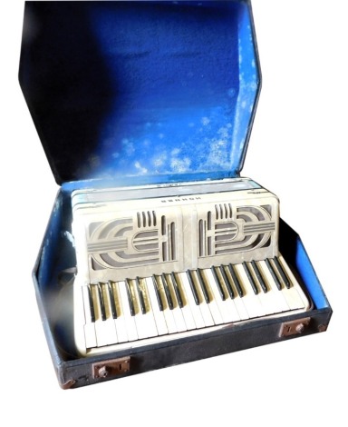 A Hohner Verdi III piano accordion, in a fitted case.