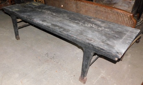 A large Chinese elm low or coffee table, the rectangular top above a shaped apron and tapering legs, on block feet, 57cm high, 209cm wide, 70cm deep.