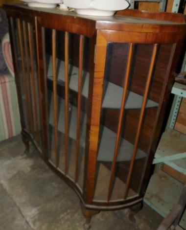 A display cabinet, with two glazed doors, glazed sides, on cabriole legs with pad feet, 115cm wide.