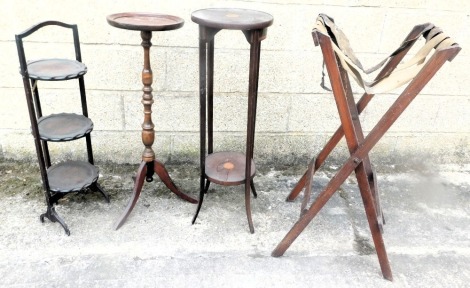 An Edwardian mahogany and inlaid two tier plant stand, a mahogany plant stand, a folding butlers tray stand, a cake stand, and a whatnot.