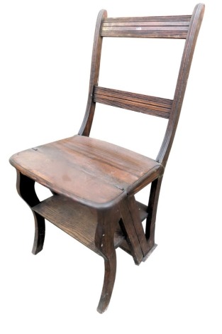 An oak metamorphic library chair/steps, of plain form with a reeded and slated back.