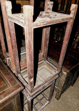 Various late 19th/early 20thC Chinese elm urn tables, each with a carved frieze on shaped legs with slatted base, approximately 77cm high, 42cm wide. (AF)