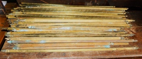 A quantity of brass stair rods, of triangular section and a set of spiral rods.