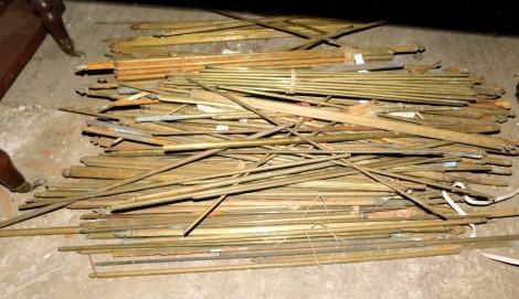 A quantity of brass stair rods.