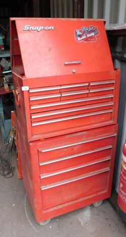 A Snap-On red metal tool chest, with an arrangement of drawers, on castors, 120cm high, 66cm wide, 47cm deep, containing some tools.