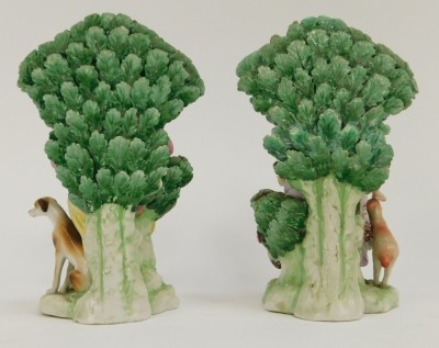 A pair of Continental Derby style porcelain figure groups, of lady and gentleman seated on perch with floral spray back, red crown stamp to underside, 15cm high. - 3