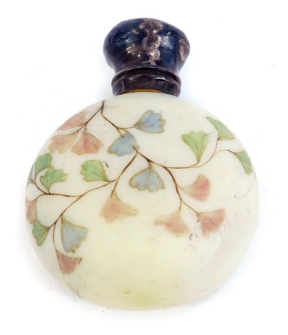 An Edwardian opaque glass scent bottle, with silver cap and stopper, marks indistinct, the glass decorated with delicate hand painted foliage, 6.5cm high.