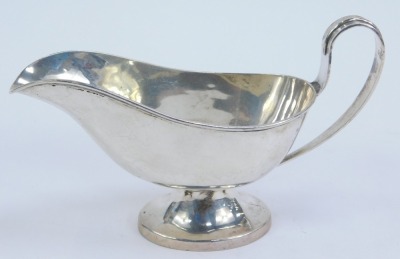 A George V silver sauce boat, of plain design with stylised rat tail handle, and raised on a tapered oval foot, Birmingham 1915, 2.68oz. - 3