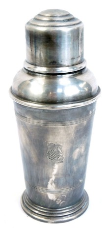 A silver plated cocktail shaker, of tapered cylindrical form, with an engraved and S and thistle, by The Goldsmiths & Silversmiths Company, 21cm high.