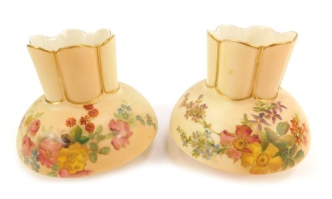 A pair of Royal Worcester blush porcelain vases, c1901, of crenellated compressed form, shape 991, painted with sprays of flowers, printed and painted marks, 8cm high.