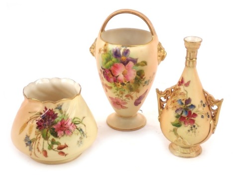 A group of Royal Worcester blush porcelain, comprising a basket shaped vase, c1934, with lions head terminals, shape 6/50, painted with flowers, printed marks, 13cm high, a twin handled vase, c1935, of pear shaped baluster form, shape no 982, painted with