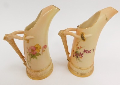 Two Royal Worcester blush porcelain jugs, c1900 and 1903, of tusk form with an antler handle, shape no 1115, each painted with sprays of flowers, printed and painted marks, each 15cm high. (2) - 2