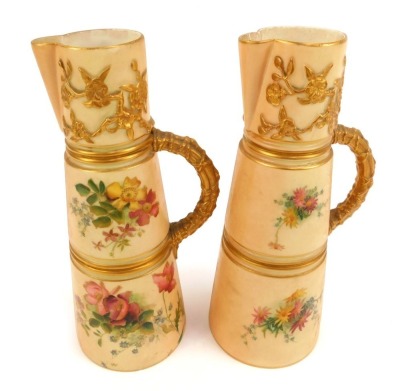 A pair of Royal Worcester blush porcelain jugs, c1903, of tapering form, shape no 1047, painted with sprays of flowers, printed marks, 21cm high.