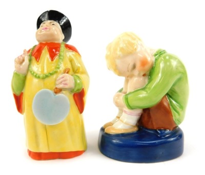 A Royal Worcester porcelain candle snuffer, circa 1923, modelled as a china man, standing holding a fan, printed marks, and a Royal Worcester figure modelled by Margaret Cane as Sleepy Boy, number 2918. (2, AF)