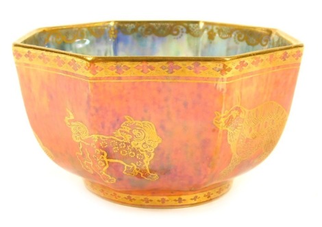 A Wedgwood dragon lustre bowl, of octagonal form, decorated externally with animals, against a mottled orange ground, pattern number Z4825T, printed and painted marks, 10cm wide.