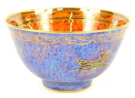 An early 20thC Wedgwood bird lustre bowl, decorated internally with a bird against a mottled orange ground, externally with birds against a powder blue ground, pattern number Z5294, printed and painted marks, 9cm wide.