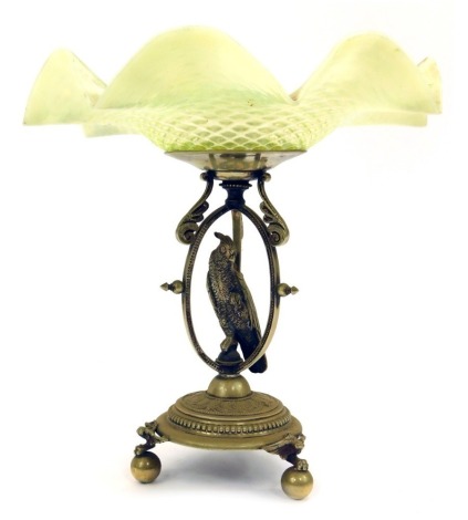 A 1920/30s vaseline glass and silver plated centrepiece, the flared green glass top, on a shaped base depicting parrot in bird cage, on tripod ball claw base, 26cm high, 22cm wide.