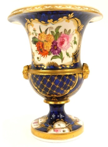 A mid 20thC porcelain campana vase, with a fluted and flared rim top with gilt decoration and painted floral panel, unmarked, 19cm high.