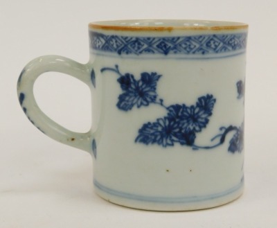 A 19thC blue and white Chinese coffee can, with a patched floral design border and green wood bottom, 6.5cm high. - 2