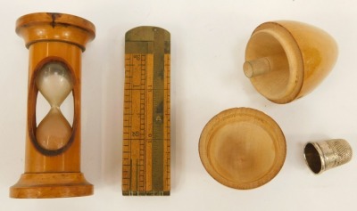 A group of treen, comprising a Leamington Spa egg cup, a treen dice shaker, egg timer, Forth Bridge Switzerland money bank barrel, folding rule, egg cup, etc. (7) - 2