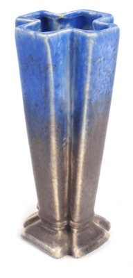 An Empire Ware fluted vase, shaped as a cross, with blue and grey mottled decoration, 14cm high.