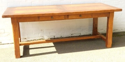 An early 20thC oak plank top refectory table, with two additional leaves, with two frieze drawers, raised on chamfered square legs united by an H framed stretcher, 25;cm high, 199cm wide, 299cm extended, 85cm deep.