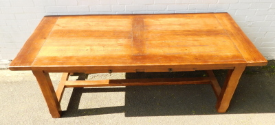 An early 20thC oak plank top refectory table, with two additional leaves, with two frieze drawers, raised on chamfered square legs united by an H framed stretcher, 25;cm high, 199cm wide, 299cm extended, 85cm deep. - 2