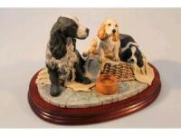 A Border Fine Arts figure group of a Cocker Spaniel and pups