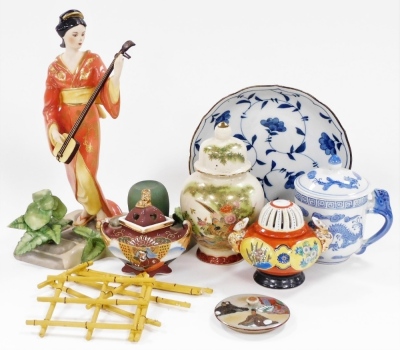 A group of Japanese and Chinese porcelain and pottery, including a Satsuma koro and cover, vase and cover, figure of a Japanese lady playing a samisen, and a Chinese porcelain chocolate cup and cover. (a quantity) - 14