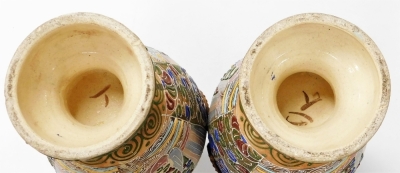 A pair of Meiji period Japanese Satsuma moriage vases, of twin handled baluster form, decorated with panels of priests, on a ground of flowers and scrolls, 39cm high. - 12