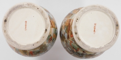 A pair of Meiji period Japanese Satsuma vases, decorated with reserves of ladies by a lake, and samurai in a landscape setting, within a floral ground, signed to the base, 36.5cm high. - 12