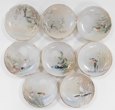 An early 20thC group of Japanese porcelain, including eight dishes painted with birds, and a bowl painted with a mountain landscape. (a quantity) - 15