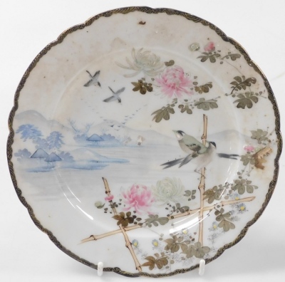 A group of Chinese and Japanese porcelain, including Japanese plates painted with birds and flowers, tea bowls, and a Chia Ching blue and white saucer. (a quantity) - 22