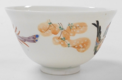 A group of Chinese and Japanese porcelain, including Japanese plates painted with birds and flowers, tea bowls, and a Chia Ching blue and white saucer. (a quantity) - 24