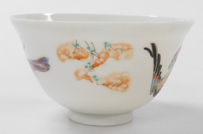 A group of Chinese and Japanese porcelain, including Japanese plates painted with birds and flowers, tea bowls, and a Chia Ching blue and white saucer. (a quantity) - 26