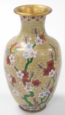 A group of Chinese metalwares, comprising a cloisonne vase decorated with prunus blossom on a yellow ground, 21cm high, cloisonne bowl decorated with dragons on a black ground, 20cm wide, bronzed metal tea canister, white metal vase, pair of wooden carvin - 18