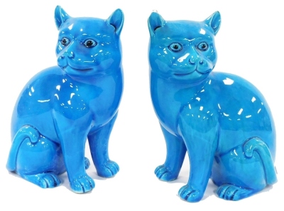 A pair of Chinese turquoise porcelain figures of cats, modelled in seated pose, 16cm wide. (AF) - 5